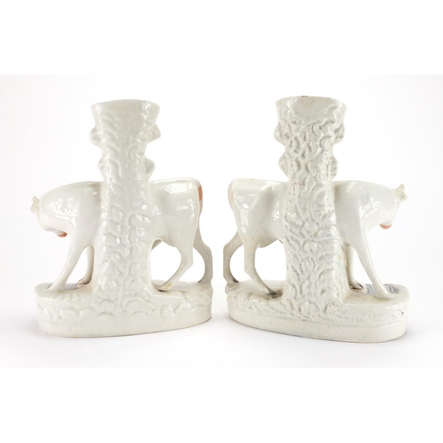 828 - Pair of Victorian Staffordshire flat back cow and calf spill vases, each 27.5cm high
