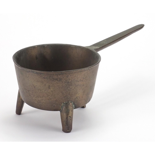 101 - Antique bronze three footed skillet, 37.5cm in length