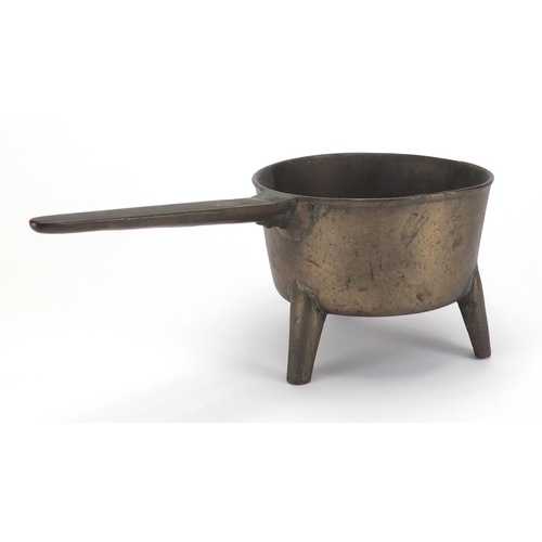 101 - Antique bronze three footed skillet, 37.5cm in length