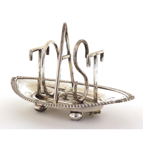 1039 - Silver plated Toast design toast rack, in the style of Christopher Dresser, 18cm in length