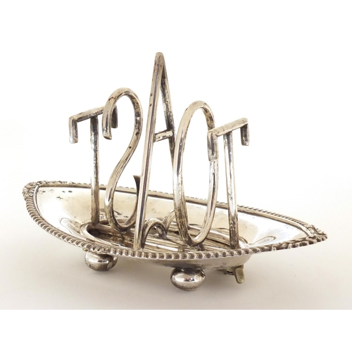 1039 - Silver plated Toast design toast rack, in the style of Christopher Dresser, 18cm in length