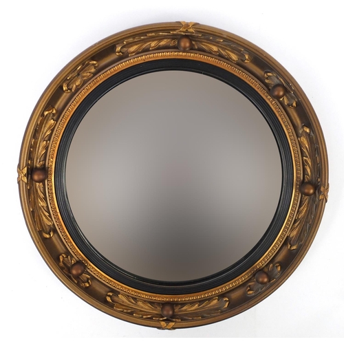 22 - Circular gilt framed convex mirror, Atsonea label the the back, 46cm in diameter