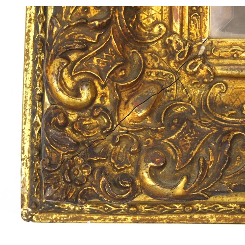 45 - Ornate gilt framed bevelled edge mirror,with peach glass, 101cm x 73.5cm