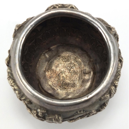 748 - Burmese unmarked silver bowl, embossed with huntsmen and animals, 7.5cm high, approximate weight 152... 