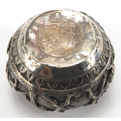 748 - Burmese unmarked silver bowl, embossed with huntsmen and animals, 7.5cm high, approximate weight 152... 