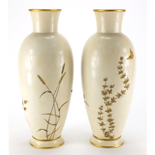 811 - Pair of Royal Worcester aesthetic porcelain vases, gilded with butterflies above flowers and ferns, ... 