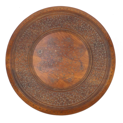2017 - Circular carved hardwood occasional table, with octagonal base and metal inlay, 48cm high x 45cm in ... 