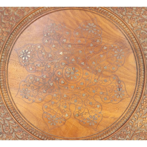 2017 - Circular carved hardwood occasional table, with octagonal base and metal inlay, 48cm high x 45cm in ... 