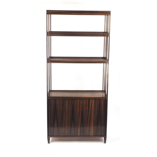 2015 - Madagascar ebony room divider, fitted with three galleried shelves above a pair of cupboard doors, e... 