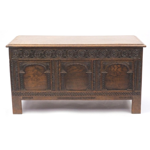 2009 - Oak coffer carved with roundels and arches, 59cm H x 110cm W x 46cm D