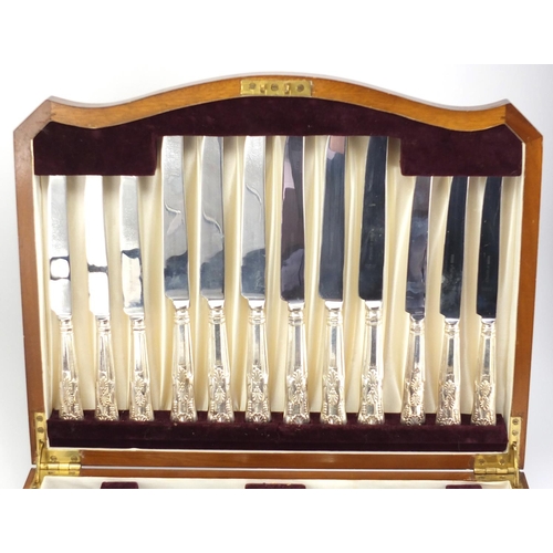 2035 - Viners six place canteen of Sheffield silver plated cutlery, housed in a serpentine fronted walnut c... 