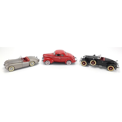 2065 - Three die cast precision model vehicles by The Danbury Mint, 1940 Ford Deluxe, Stutz Black Hawk and ... 