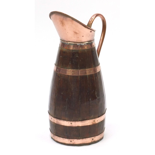 42 - Large oak and copper pitcher, 62cm high