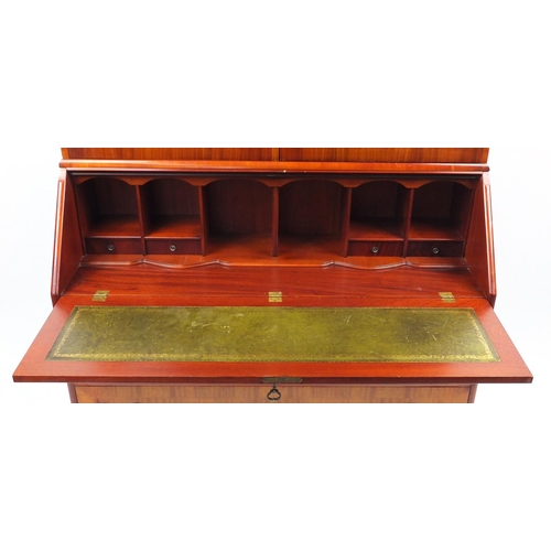 13 - Inlaid yew bureau book case, fitted with a pair of arch shaped glazed doors, above a fall and four d... 