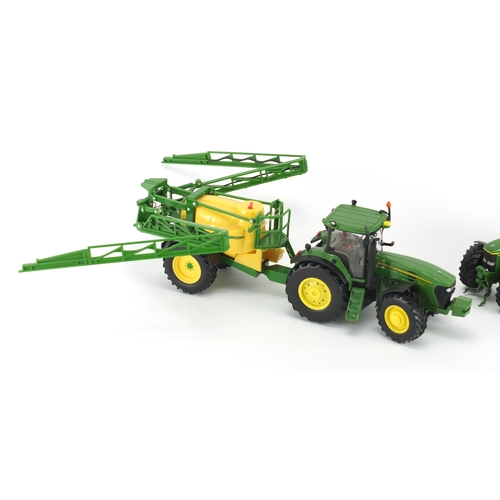 2088 - Two John Deere die cast tractors, Schucho Britain's and Ertle