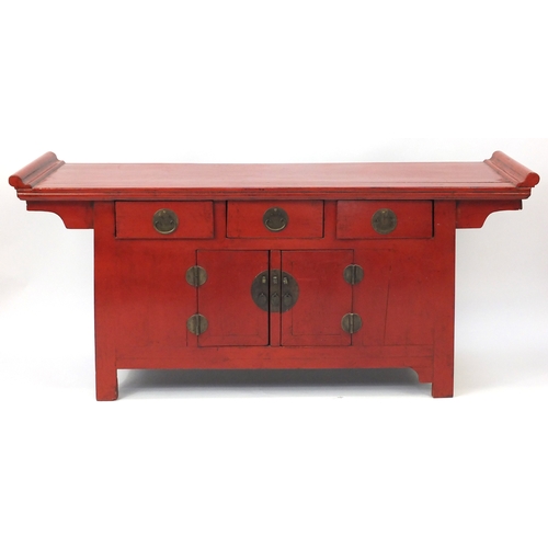 2016 - Chinese red lacquered altar sideboard, fitted with three drawers above a pair of cupboard doors, 87c... 