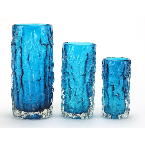 894 - Graduated set of three Whitefriars kingfisher blue cylindrical bark vases, designed by Geoffrey Baxt... 