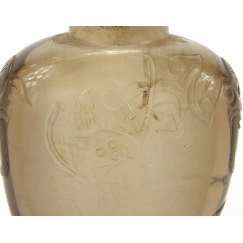 684 - Chinese rock crystal snuff bottle carved with animalia handles and three bats, 5.5cm high