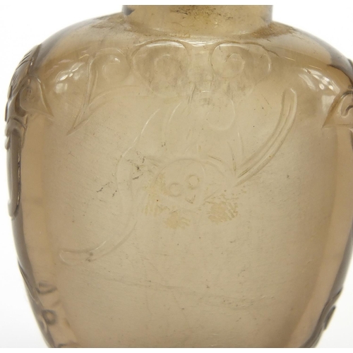 684 - Chinese rock crystal snuff bottle carved with animalia handles and three bats, 5.5cm high