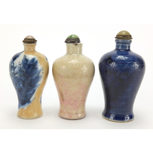 692 - Three Chinese porcelain and stoneware snuff bottles with stoppers of Meiping form, two hand painted ... 