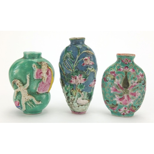 691 - Three Chinese porcelain turquoise ground snuff bottles, comprising two relief examples and one hand ... 