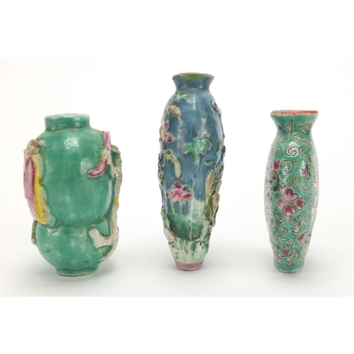 691 - Three Chinese porcelain turquoise ground snuff bottles, comprising two relief examples and one hand ... 