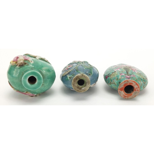 691 - Three Chinese porcelain turquoise ground snuff bottles, comprising two relief examples and one hand ... 