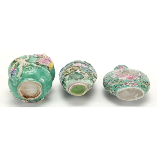 691 - Three Chinese porcelain turquoise ground snuff bottles, comprising two relief examples and one hand ... 