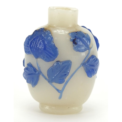 688 - Chinese Peking cameo glass snuff bottle overlaid with flowers, 5.8cm high