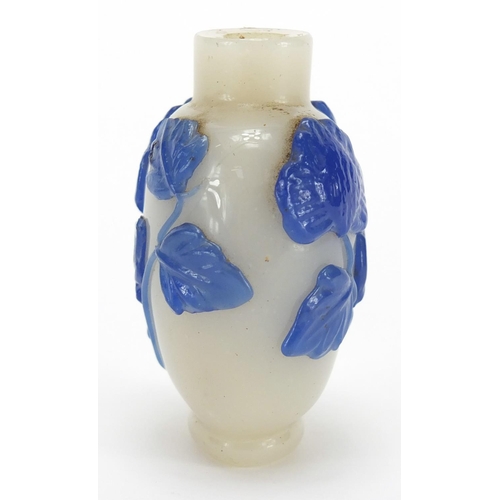 688 - Chinese Peking cameo glass snuff bottle overlaid with flowers, 5.8cm high