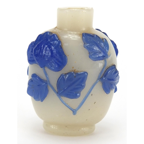 688 - Chinese Peking cameo glass snuff bottle overlaid with flowers, 5.8cm high