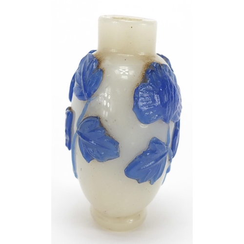 688 - Chinese Peking cameo glass snuff bottle overlaid with flowers, 5.8cm high