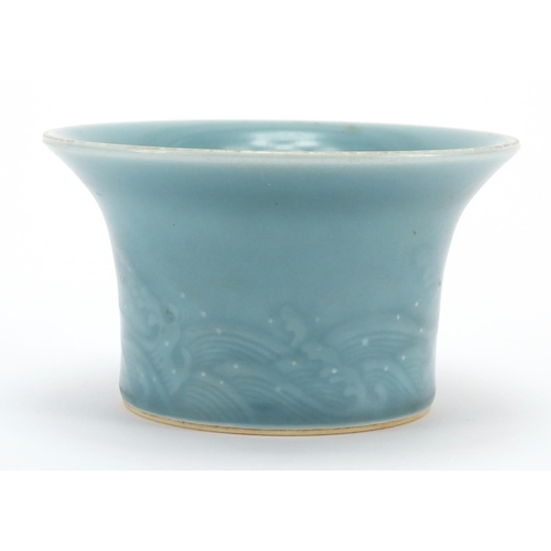 623 - Chinese porcelain blue glazed bowl with fluted rim, incised with a continuous band of crashing waves... 