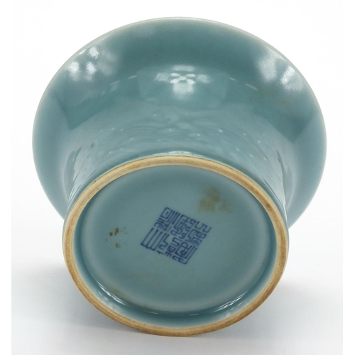 623 - Chinese porcelain blue glazed bowl with fluted rim, incised with a continuous band of crashing waves... 