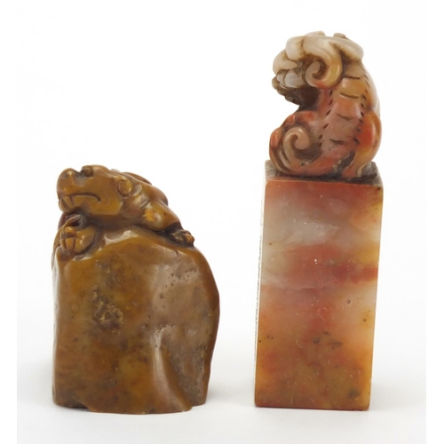 710 - Two Chinese soapstone seals, carved with a dragon and  Dog of Foo, the largest 9.7cm high