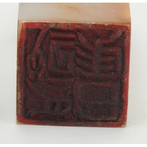 710 - Two Chinese soapstone seals, carved with a dragon and  Dog of Foo, the largest 9.7cm high