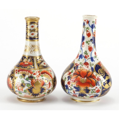 814 - Two 19th century Derby porcelain bottle vases, hand painted and gilded in the Imari palette, painted... 