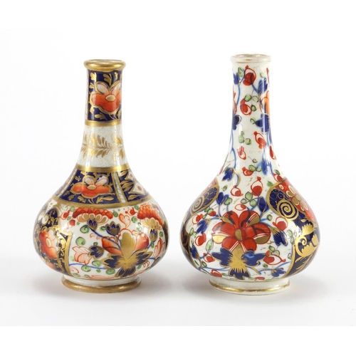 814 - Two 19th century Derby porcelain bottle vases, hand painted and gilded in the Imari palette, painted... 