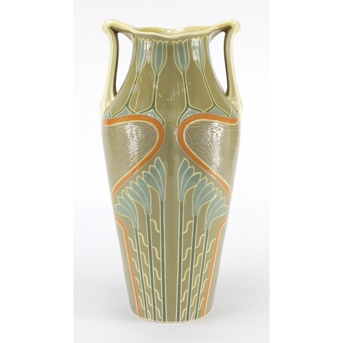 1002 - Continental Art Nouveau pottery vase with twin handles, hand painted and incised with stylised flowe... 