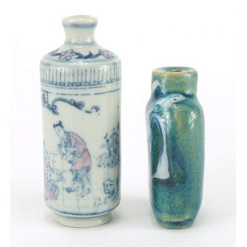 693 - Two Chinese porcelain snuff bottles, including a cylindrical example hand painted with figures in an... 