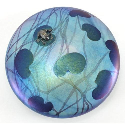 913 - Glasform iridescent glass lily pad paperweight mounted with a silver frog by John Ditchfield, etched... 