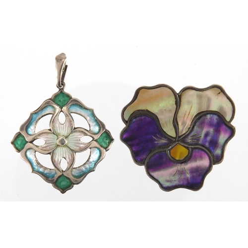 1041 - Two Art Nouveau silver brooches including an enamelled flower head example, both with indistinct mak... 