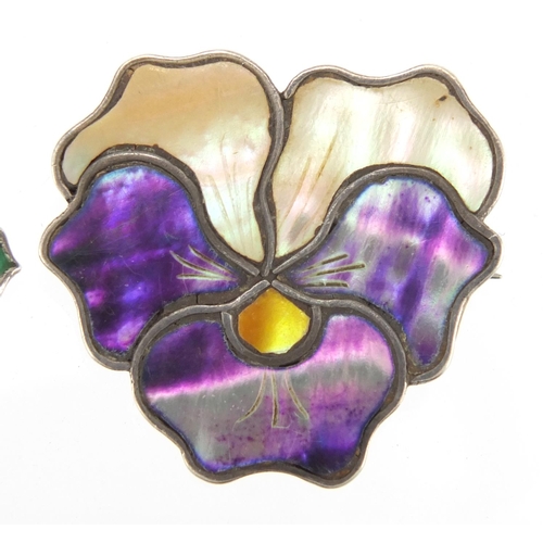 1041 - Two Art Nouveau silver brooches including an enamelled flower head example, both with indistinct mak... 