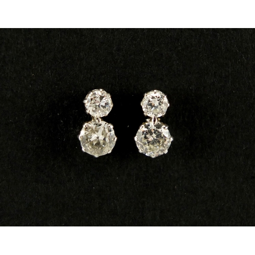 1050 - Pair of unmarked white metal diamond stud earrings,  9mm in length, approximate weight 1.8g, housed ... 