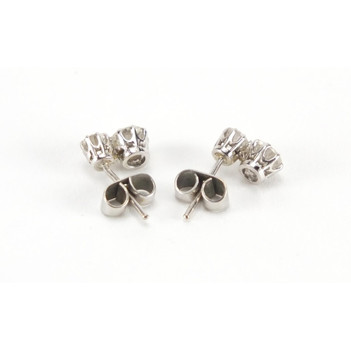 1050 - Pair of unmarked white metal diamond stud earrings,  9mm in length, approximate weight 1.8g, housed ... 