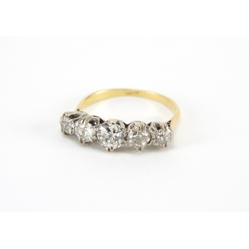 1059 - 18ct gold diamond five stone ring, size M, approximate weight 2.3g