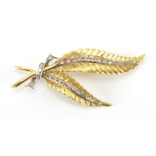 1058 - 18ct two tone gold and diamond fern brooch, RHB makers mark, 6cm in length, approximate weight 12.2g