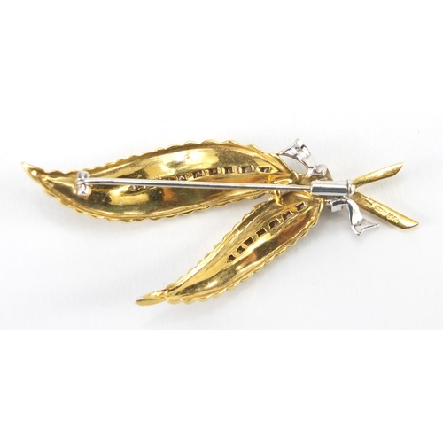 1058 - 18ct two tone gold and diamond fern brooch, RHB makers mark, 6cm in length, approximate weight 12.2g