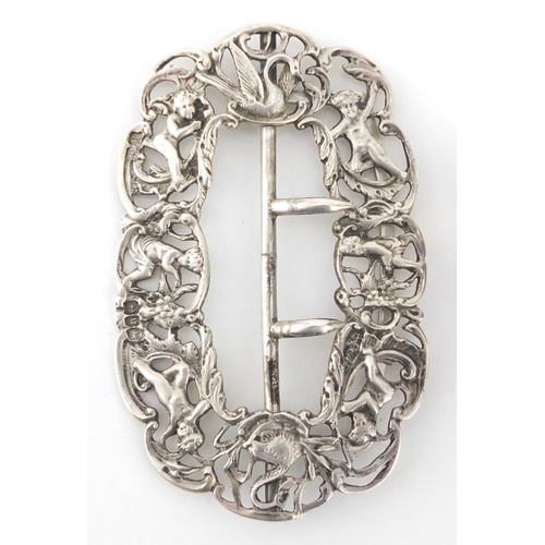 217 - Silver objects comprising a Victorian buckle with cherubs and swans, rectangular vesta and matchbox ... 
