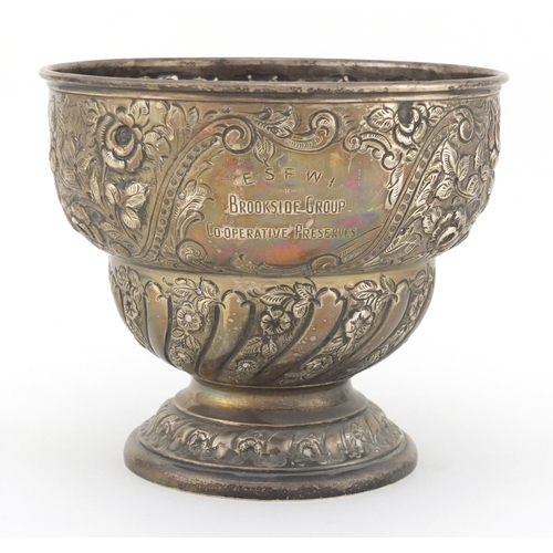 201 - Victorian silver pedestal bowl profusely embossed with flowers, with Brookside Group Co-operative Pr... 
